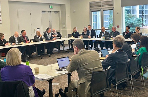 Image of an academic roundtable discussion, representing collaboration.