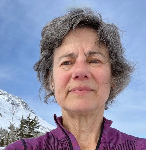 Headshot of Betsy Baker, taken in April 2024, showcasing her academic contributions.
