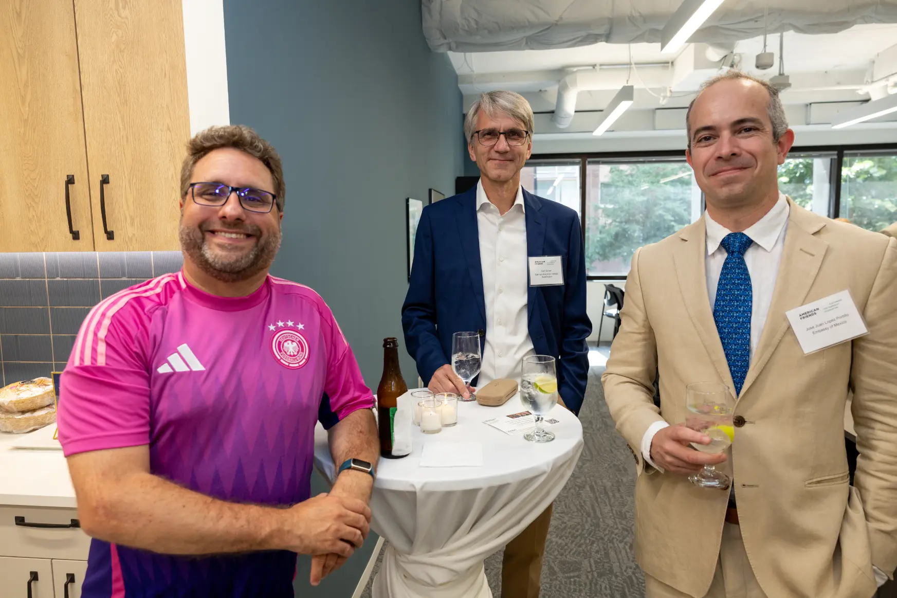 Image of the AFAvH office warming party, emphasizing discussions and presentations.