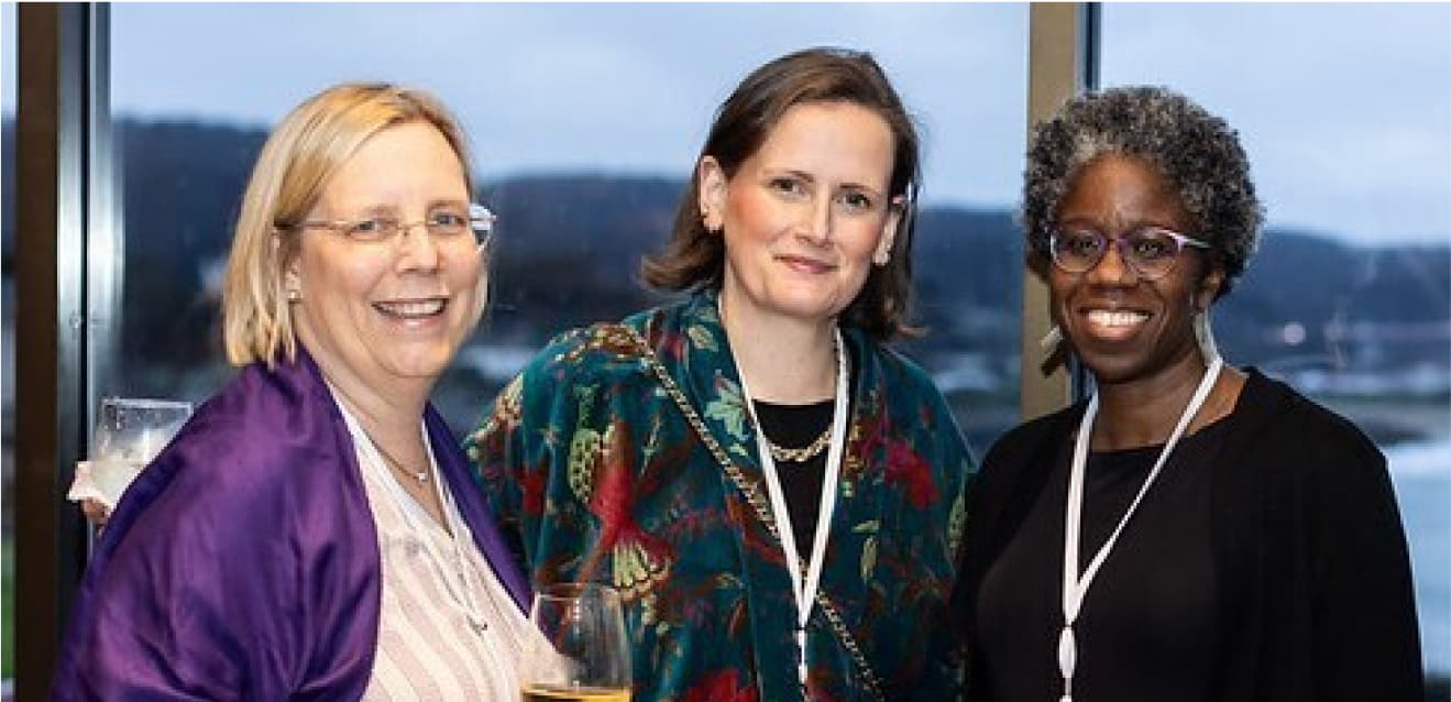 Board members Louise (left) and Andrea (right) smiling together at the Celebrate 25 event